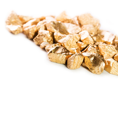 Gold nuggets isolated on white background.の写真素材