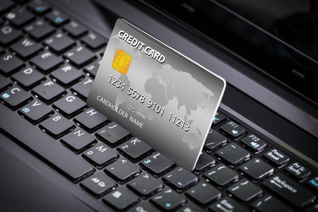 credit card information into a laptopの写真素材