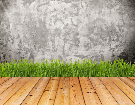 Old wall and green grass on wood floor background. High resolution.の写真素材