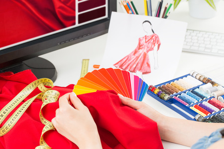 Fashion designer working in studio. Close up design.の写真素材
