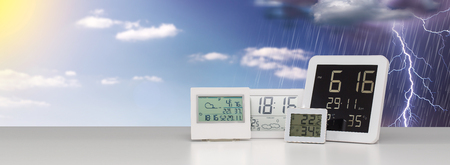 Weather station device with weather conditions outside background.の写真素材