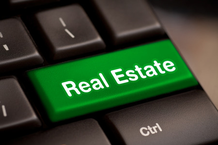 Computer keyboard with real estate key.の写真素材
