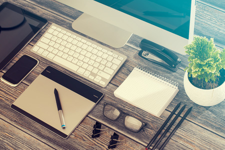 Designer's desk with responsive design mockup concept.の写真素材