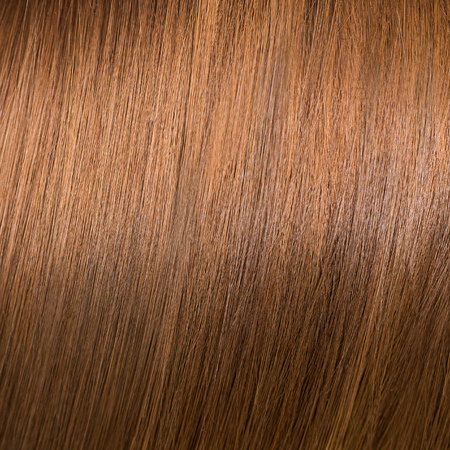 Beautiful shiny brunette hair texture on background.の写真素材