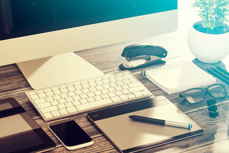 Designer's desk with responsive design mockup concept.の写真素材