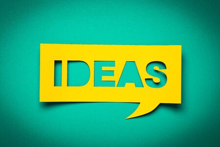 Bubble speech with cut out phrase "ideas" in the paper.の写真素材