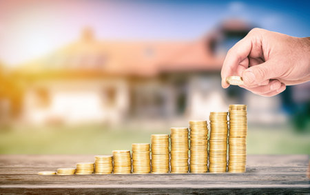 Saving money concept. Businessman hand putting money coin stack growing business.