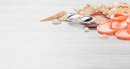 Beach accessories on wooden board. Concept of the summer time.の写真素材