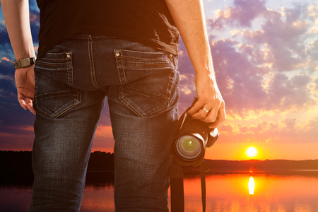 photographer photographic camera dslr photo person passion outdoor photographing travel make photography sunset sky background space banner concept - stock imageの写真素材