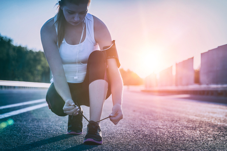 run runner sport shoe road jogging flare sunset asphalt street fitness cross sunbeam success running sportswear - stock imageの写真素材