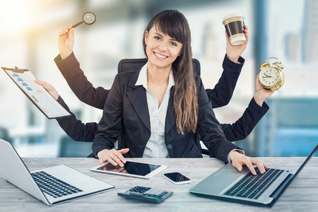 Multitask business woman with many hands. Performing several actions at the same time.