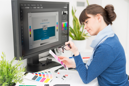 Graphic designer at work. Color swatch samples.の写真素材