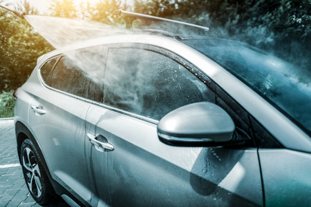 Manual car wash with pressurized water in car wash outside.の写真素材