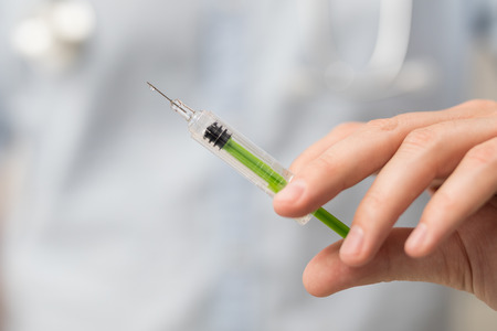 Syringe, medical injection in hand. Vaccination equipment with needle.の写真素材