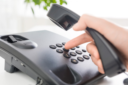 Communication support, call center and customer service help desk. Using a telephone keypad.の写真素材