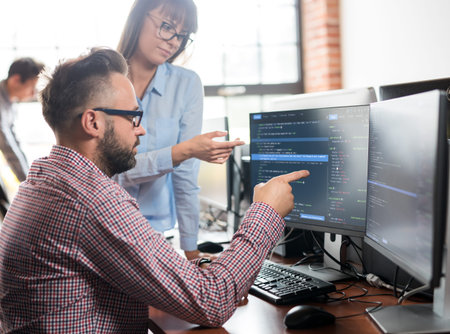 Developing programming and coding technologies. Website design. Programmer working in a software...
