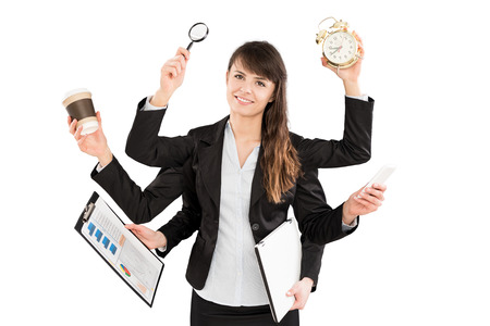 Multitask business woman with many hands. Performing several actions at the same time.の写真素材