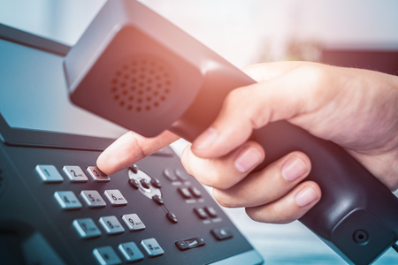 Communication support, call center and customer service help desk. Using a telephone keypad.の写真素材