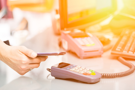mobile payment phone retail nfc pay paying smart shopping reader woman wireless concept - stock imageの写真素材