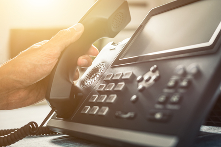 Communication support, call center and customer service help desk. Using a telephone keypad. の写真素材
