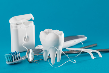 White healthy tooth, different tools for dental care. Dental background.の写真素材