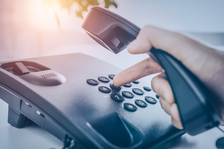 Communication support, call center and customer service help desk. Using a telephone keypad.の写真素材