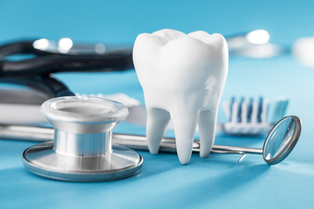 White healthy tooth, different tools for dental care. Dental background.の写真素材