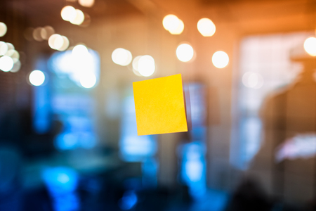 Self adhesive notes stuck on the glass in the office. Brainstorming concept.の写真素材