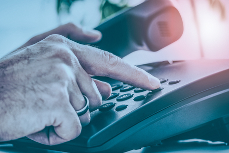Communication support, call center and customer service help desk. Using a telephone keypad.の写真素材