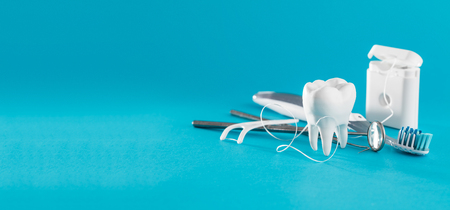 White healthy tooth, different tools for dental care. Dental background.の写真素材