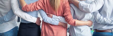 Creative team meeting hands together in line. Young business people are holding hands. Unity and teamwork concept.の写真素材