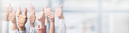 Hands showing the thumb and the symbol ok. Concept of winning people, winners.の写真素材