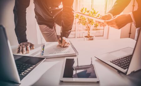 Business partners discuss and analyze documents and plans. Modern technologies in business.の写真素材