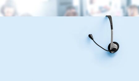 Communication support, call center and customer service help desk. VOIP headset on yellow wall background.の写真素材