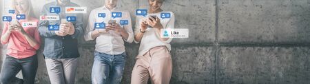 Young people watching a live streaming. Social media concept.の写真素材