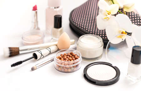 Beauty background with facial cosmetic products with empty copy space. Makeup, skin care concept with pastel colored background.の写真素材