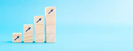 Wood block with arrow up icon. Business concept growth success process.の写真素材