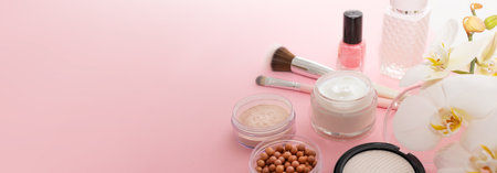 Beauty background with facial cosmetic products with empty copy space. Makeup, skin care concept with pastel colored background.の写真素材