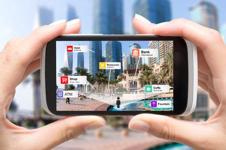 Augmented Reality (AR) marketing concept. Hand holding mobile smart phone. Information technology...