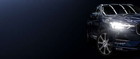 Black modern car closeup on black background.の写真素材