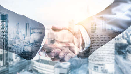 Business partnership shaking hands (handshake). Communication teamwork deal and marketing concept.の写真素材