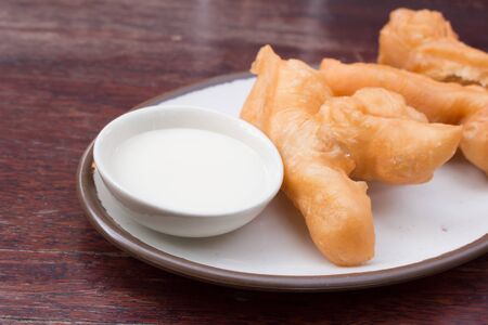 deep-fried dough stick or popularly known as You Tiao, a popular Chinese cuisineの写真素材