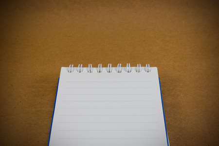 Notebook on wood paper background texture vintage styleの写真素材