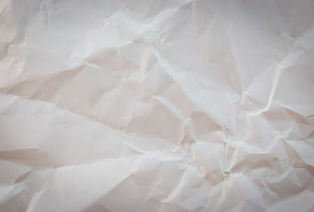 White crumpled paper background texture with vignetteの写真素材