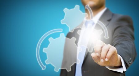 Businessman pressing digital screenの写真素材