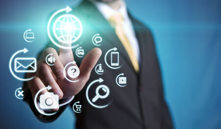 Businessman using multimedia interface with his fingersの写真素材