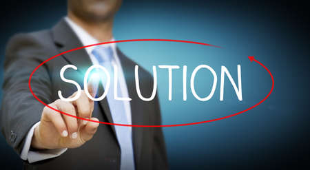 Businessman touching digital interface illustrating solution conceptの写真素材