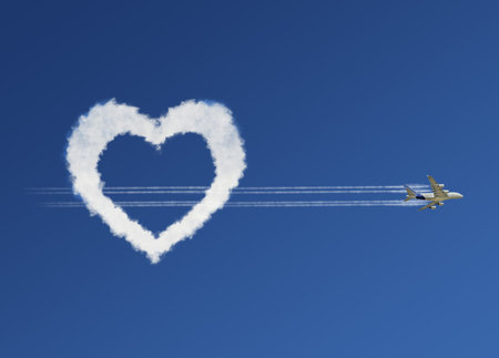 Fluffy love clouds on blue sky background