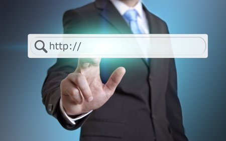 Businessman using internet on a digital screen