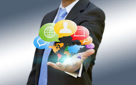 Businessman using multimedia interface with his fingersの写真素材